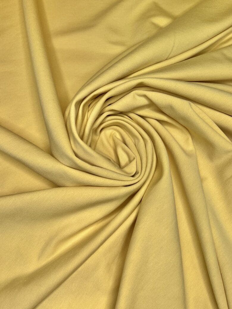 Double-sided loop knit fabric in "Melon Yellow" color