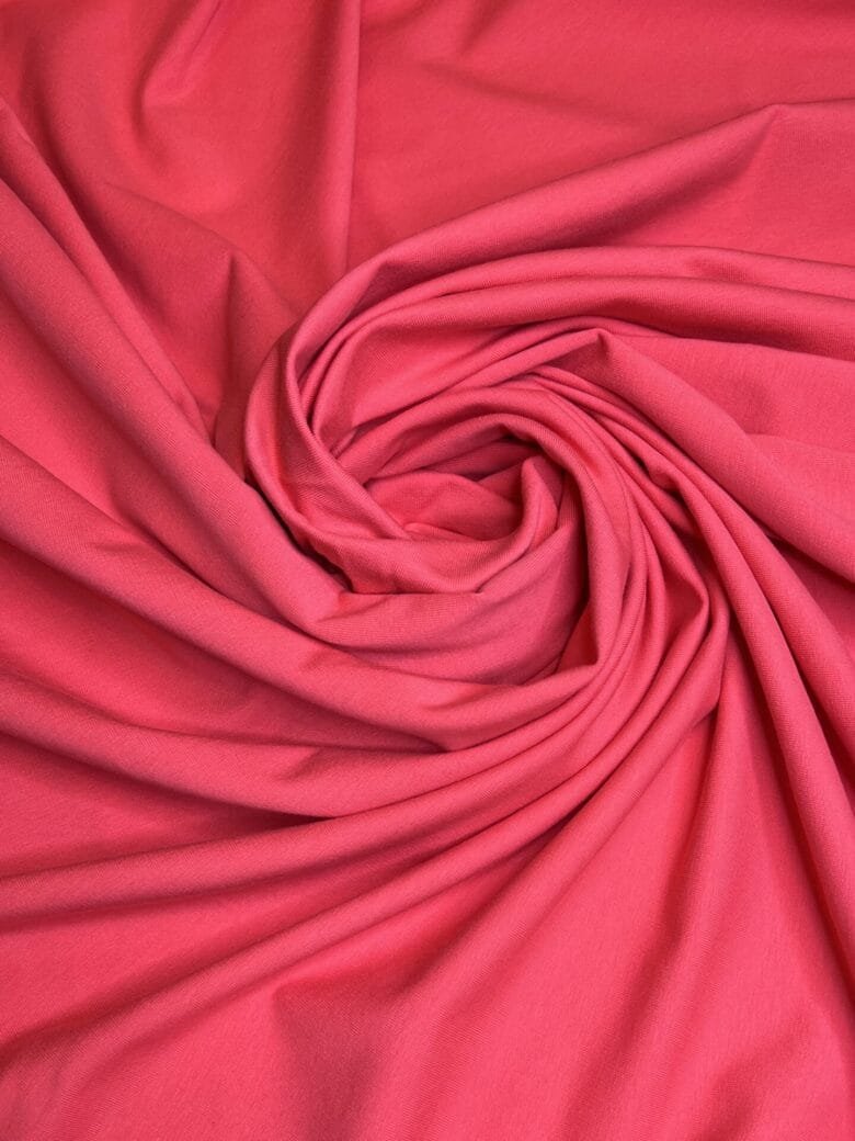 Double-sided loop knit fabric in coral pink color