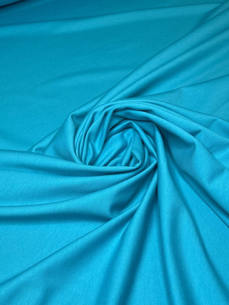 Double-sided loop knit fabric in turquoise color
