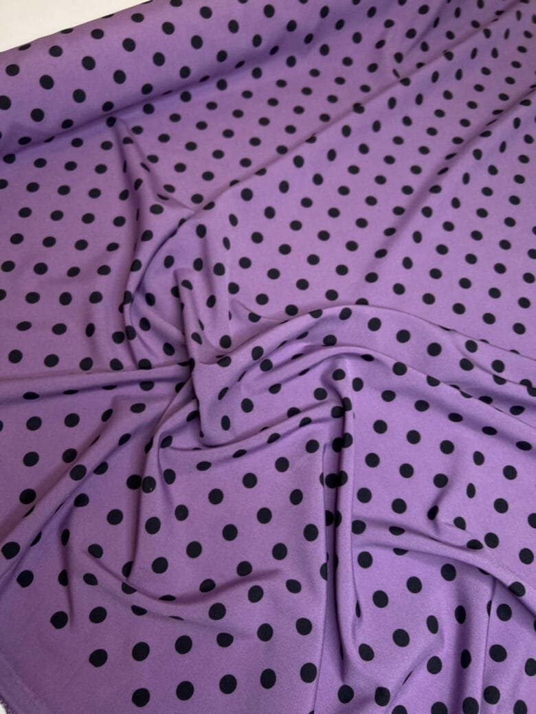 “Silky” fabric in purple with polka dot pattern