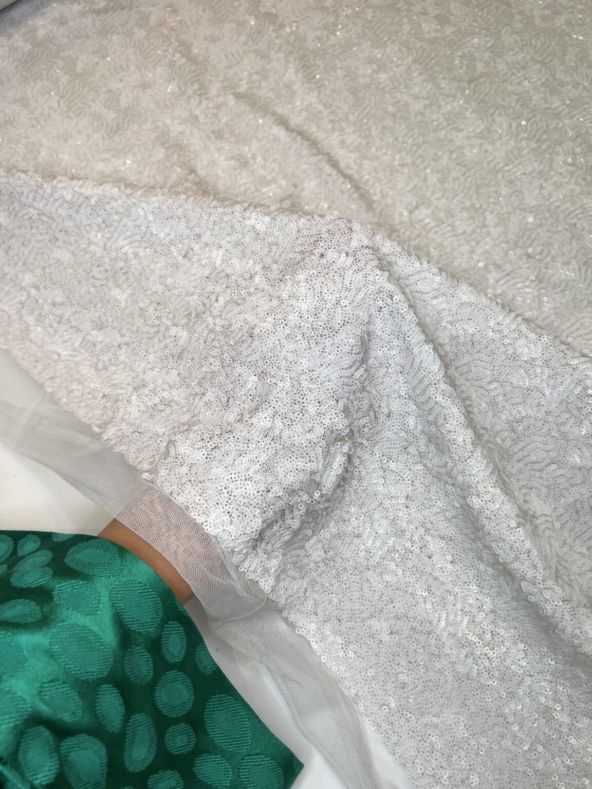 Fabric with sequins in white color