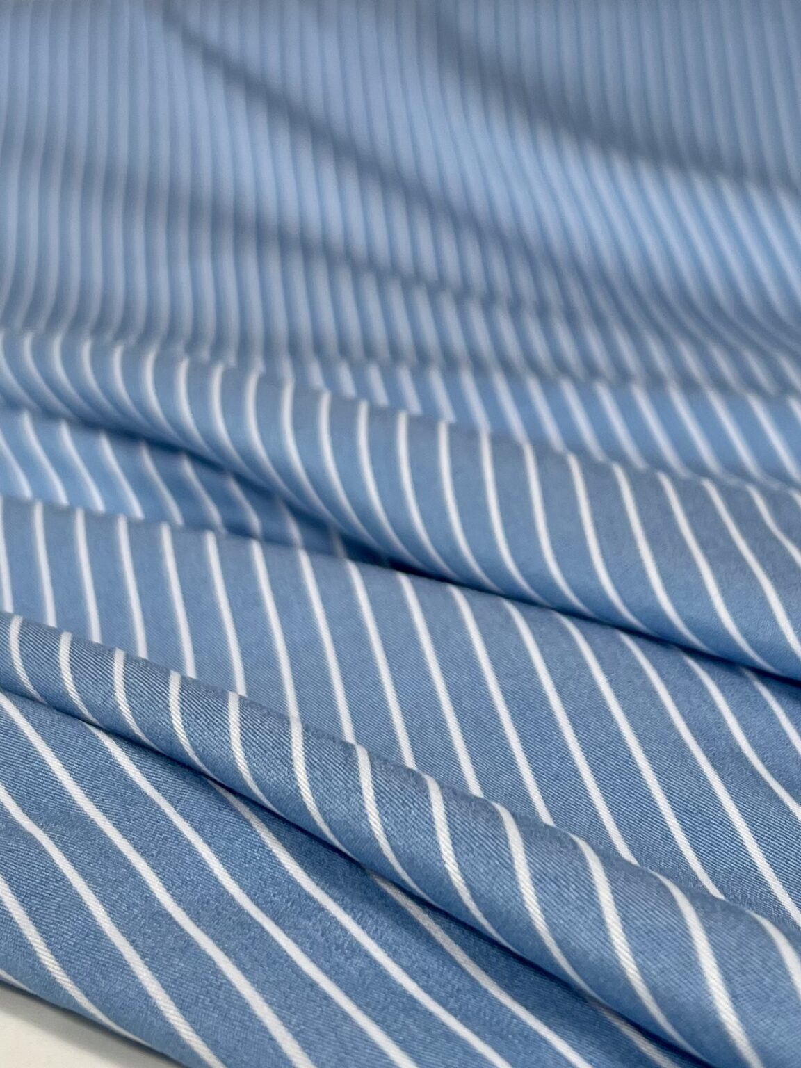 Dress-suit viscose fabric in light blue with striped pattern