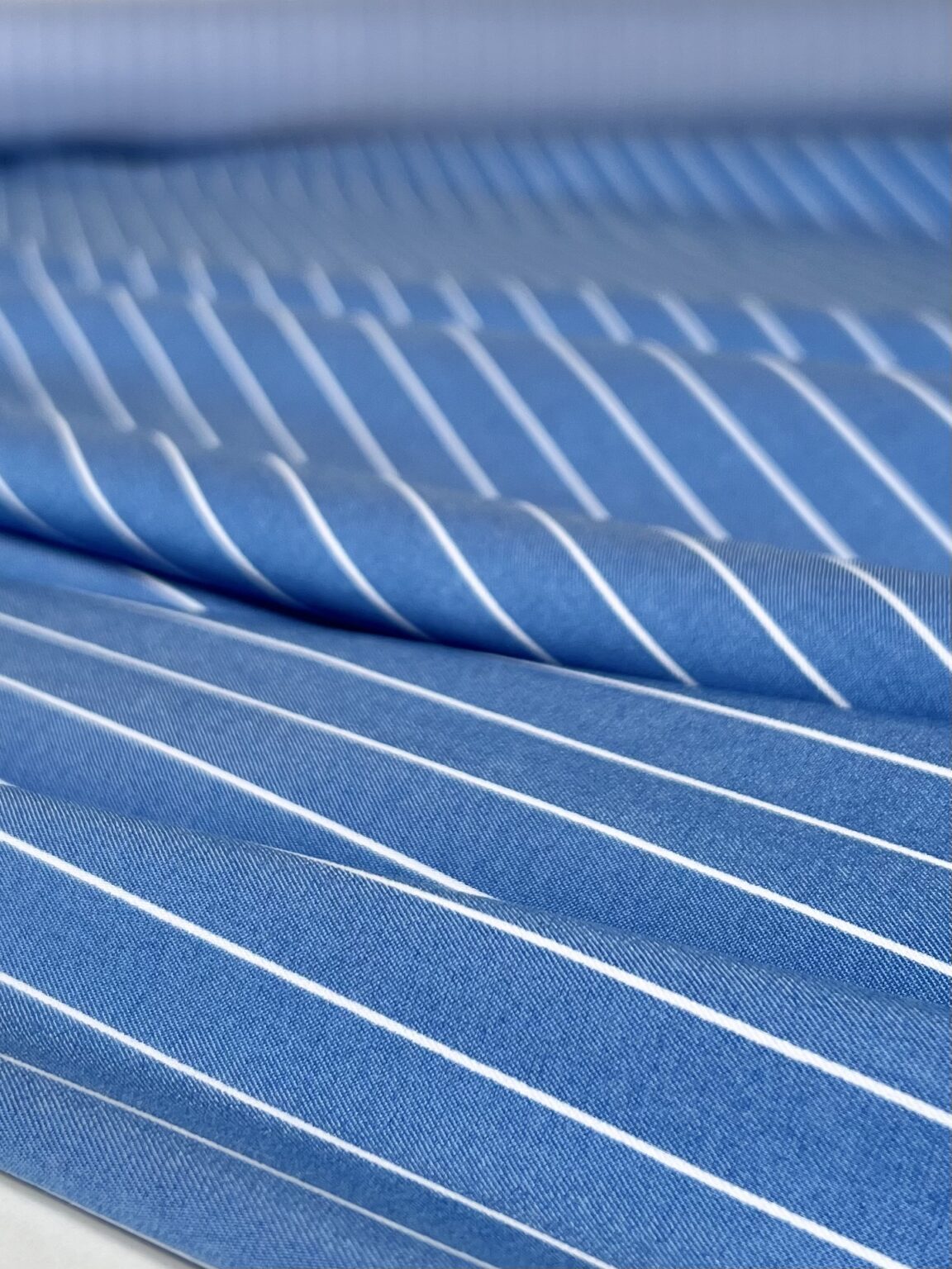 Light blue striped viscose fabric for dresses and suits