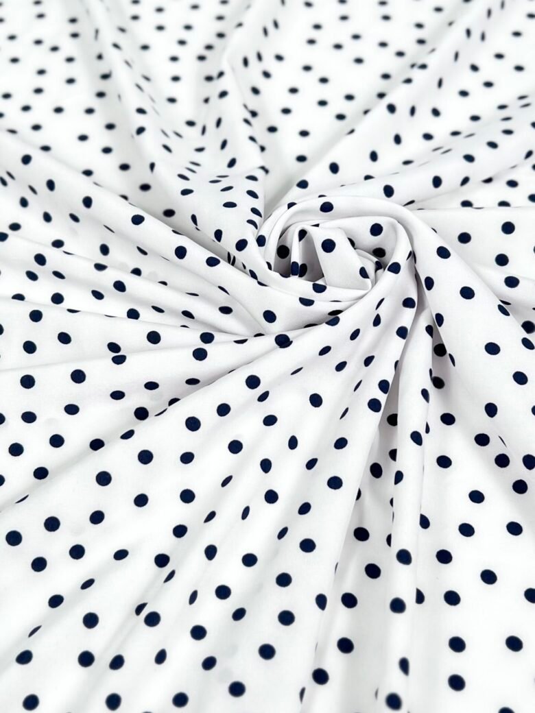"Silky" Dress Fabric with White and Blue Polka Dot Pattern